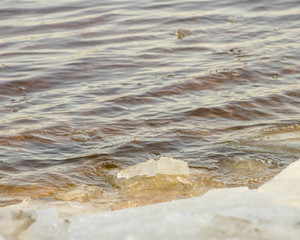 river Bank with ice fishermen
