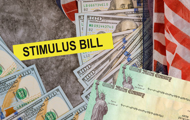 Global pandemic Covid 19 lockdown Senate stimulus deal includes individual checks virus economic stimulus plan US 100 dollar bills currency on American flag
