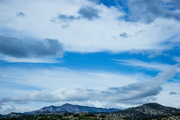 mountain range against blue sky, background with natural mountain landscape