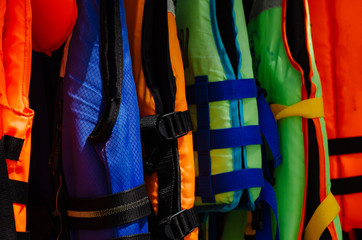 Close-up group of Life jacket or life vest hanging under the shelter at Pangkor Island, Malaysia