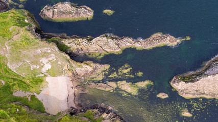 Naklejka premium Aerial drone photo - Bow Fiddle Rock is a natural sea arch near Portknockie on the north-eastern coast of Scotland. It is so called because it resembles the tip of a fiddle bow.
