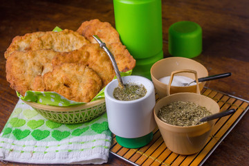 fried cakes and mate on a table
