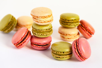 Assortment of delicious traditional french macaroons. Colorful sweet dessert for real gourmands. White background, copy space, close up, macro.