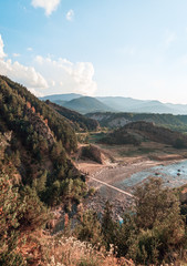 Panoramic view of a river with a wood bridge over it