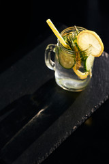 Lemonade on a dark background. Summer refreshing drink. View from above.