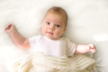 Cute adorable baby child. Happy baby girl on white background and looking at the camera.