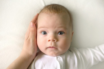 Cute adorable baby child. Happy baby girl on white background and looking at the camera.