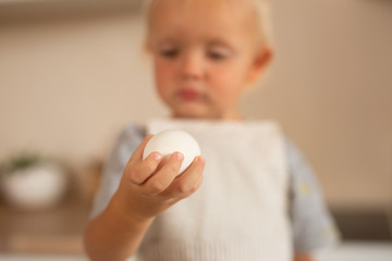 baby with an egg