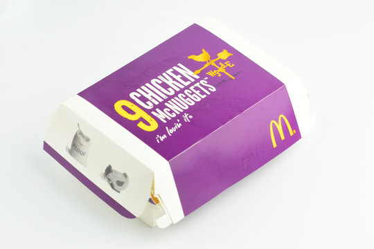 Klang, Malaysia - 4 December 2018 : View a box of MCDONALD Chicken McNuggets on the table in restaurant.