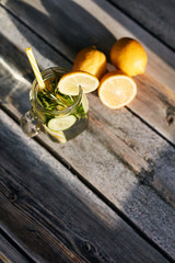 Lemonade on a light background. Summer refreshing drink.