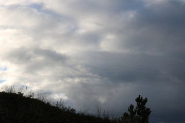 Sky behind dark hill