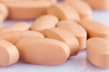 Fototapeta na wymiar Close up of Multi-Vitamin and mineral on white background
