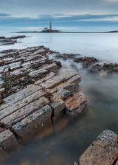 View of St Marys Lighthouse, Whitley Bay on the north east coast of England, UK. Taken during an overcast sunrise.