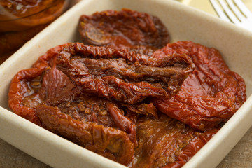 Bowl with sundried tomatoes in olive oil