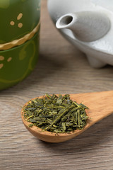 Fototapeta na wymiar Wooden spoon with Japanese green tea