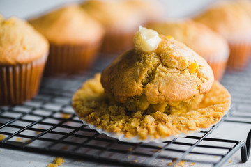 Freshly Baked Corn Muffins Group Solo topped with Honey Butter