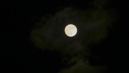 Beautiful of Full moon shining and little cloudy and dark night sky