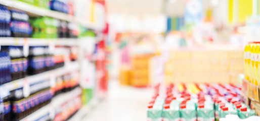 Blurred background, blur grocery supermarket at shopping store banner, blurry shelf product display and customer people  backdrop, wallpaper copy space for business concept