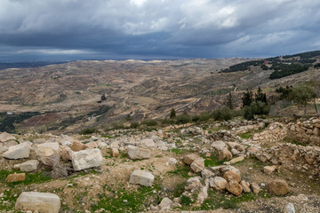 Fototapeta na wymiar Scenery view, landscape, Promised Land as seen from Mount Nebo, Kingdom of Jordan, Middle East, beautiful clouds in windy winter afternoon