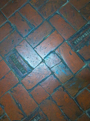   vintage tile laid on the ground with brick for background   
