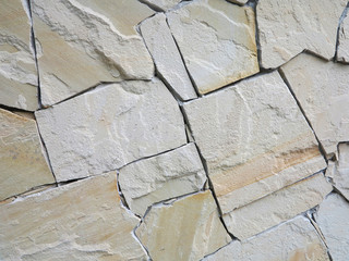  wall made of natural stone of different rocks 
