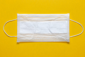 protective medical mask on orange background