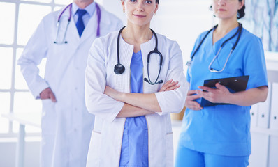 Group of doctors and nurses standing in the hospital room