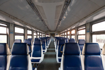 Electric train. An empty car of an intercity train. The train goes without passengers. Everything is quarantined.