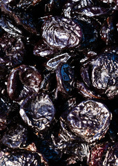 Prunes Macro. texture dry prunes closeup, food background.