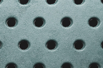 Holes in plastic plate. abstract pattern background