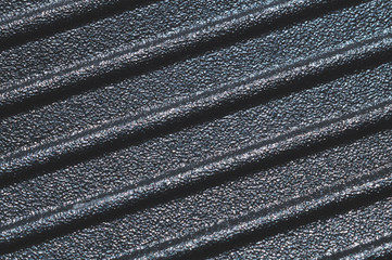 Black plastic texture. ribbed pattern. rough surface background