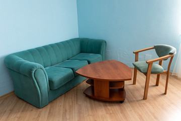 Sofa, table and chair green in the hotel meeting room.