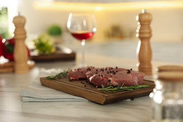 Raw meat steaks on table in kitchen. Cooking food