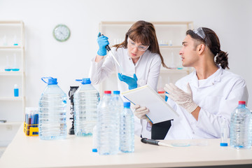 Fototapeta premium Two chemists working in the lab
