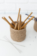 reusable bamboo beverage cans in a jute basket, preserve nature without plastic