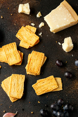 Cheese Crispies with garlic, parmesan, grape and chutney. party food snacks