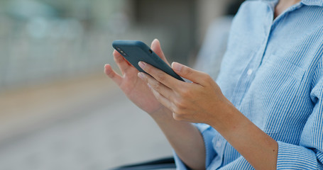 Woman use of mobile phone at outdoor