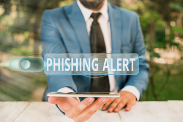 Handwriting text writing Phishing Alert. Conceptual photo aware to fraudulent attempt to obtain...