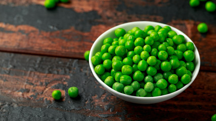 Green peas in white bowl. Healthy food