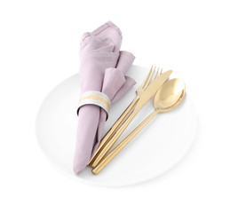Stylish elegant cutlery with napkin in plate isolated on white