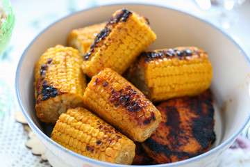 Traditional Finnish summer cottage food every Finn loves to enjoy during midsummer fest and summertime in general. Delicious homemade barbeque corn. Healthy and fresh yet yummy vegetable from grill.