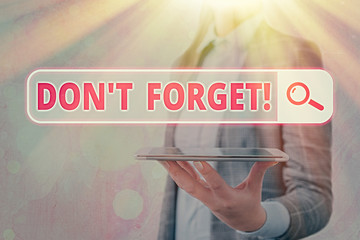 Conceptual hand writing showing Dont Forget. Concept meaning used to remind someone about an...