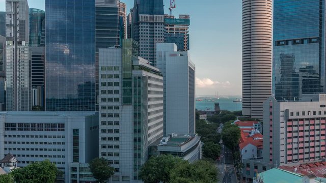 Aerial cityscape of Singapore downtown of modern architecture with skyscrapers timelapse, view from above in chinatown district before sunset