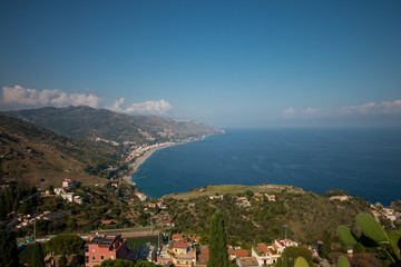 Fototapeta na wymiar Beautiful landscape of Taormina, Italy. Sicilian seascape with beach and island Isola Bella. Travel photography.