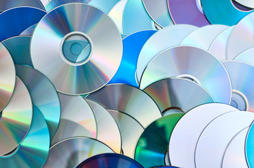 Group of old CD DVD compact optical disk storage medium with dust and scratches
