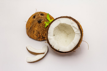 Ripe coconut cut on two half isolated on white background