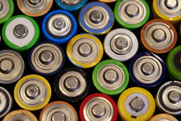 Many multicolored used batteries