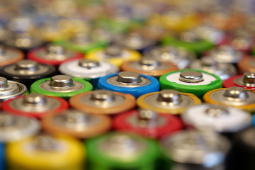 Many multicolored used batteries
