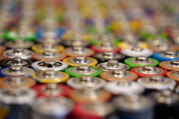 Many multicolored used batteries