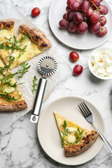 Tasty cheese pizza served on white marble table, flat lay